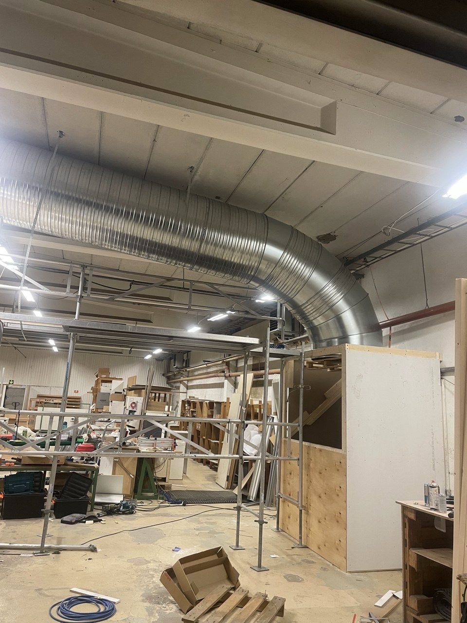 Custom ductwork installed across the facility ceiling