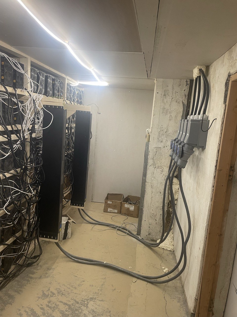 Miner racks and power cabling in the mining room